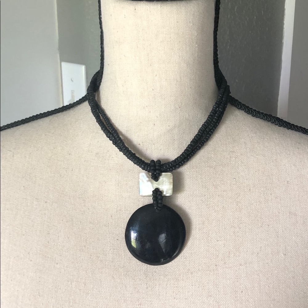 Black necklace with pearly accent piece